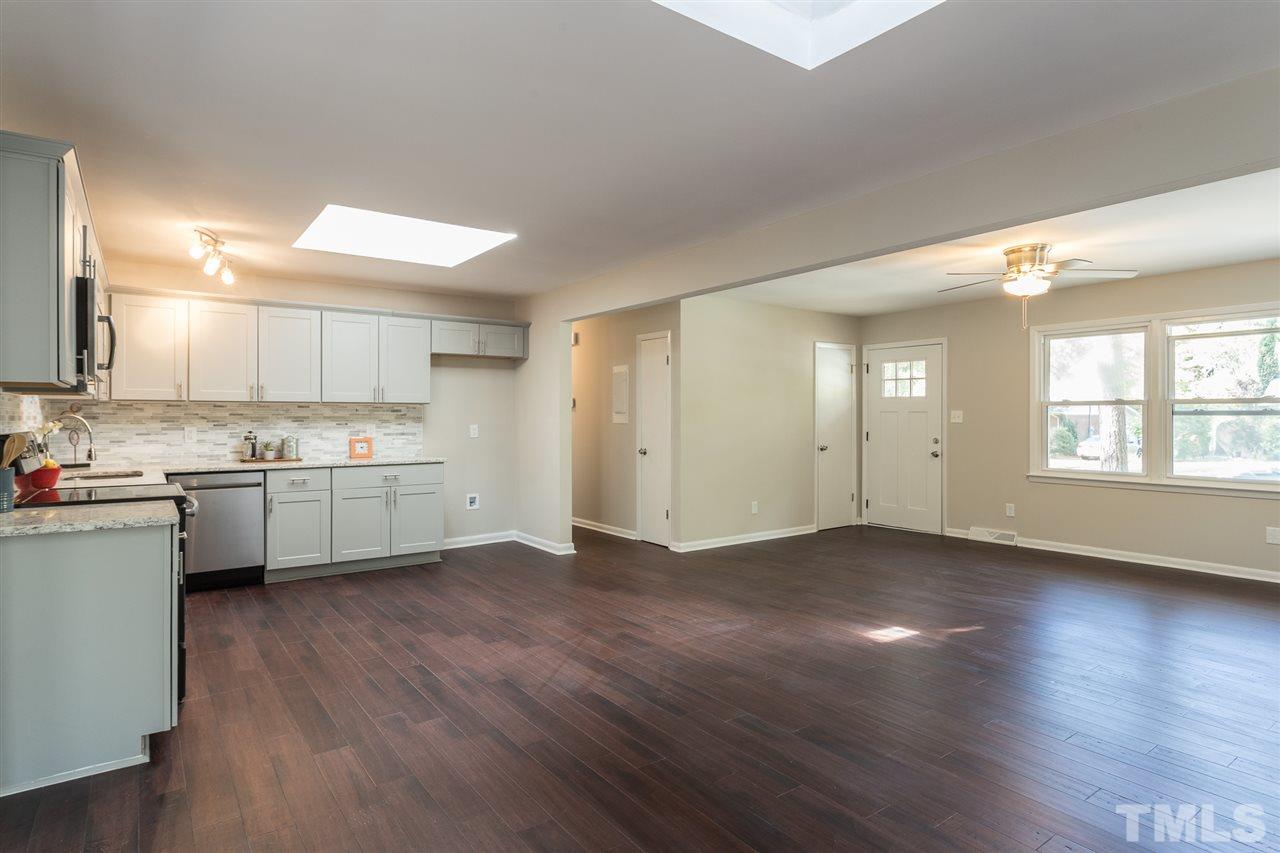 4907 Brentwood Road Durham, NC 27713 - Photo 10 of 27 a view of a kitchen with wooden floor and a window