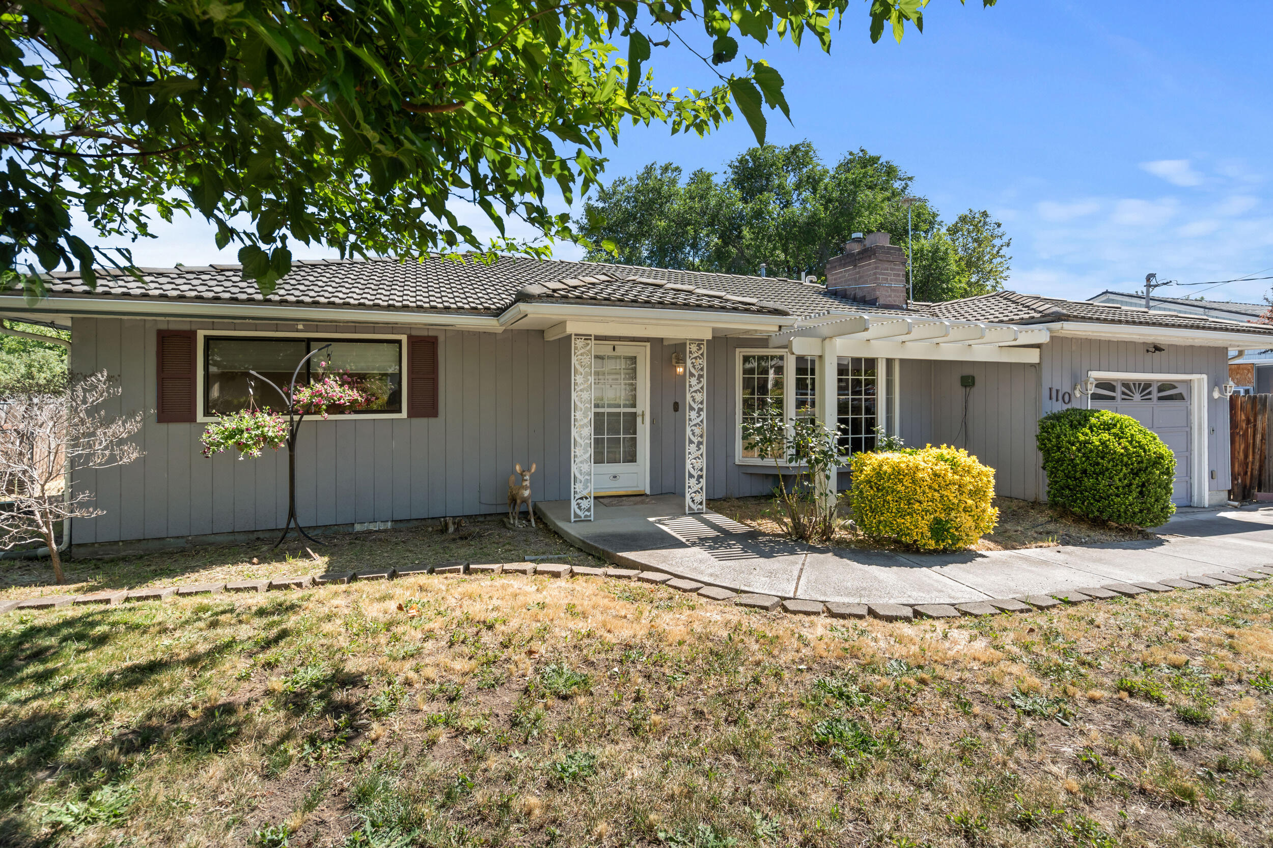 110 North 2nd Street Talent, OR 97540 - Photo 1 of 27 a view of a house with a tree in the background
