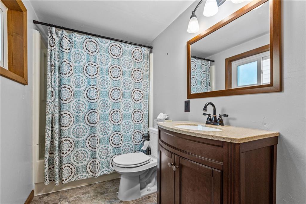 422 Mifflin Road Pittsburgh, PA 15207 - Photo 13 of 18 a bathroom with a toilet sink and mirror