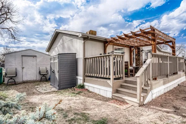 a view of a house with wooden fence