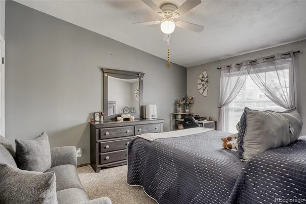 a bedroom with furniture and a bed