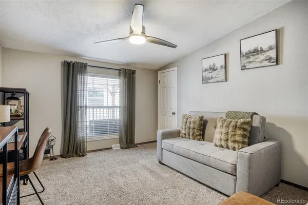 a living room with furniture and a window