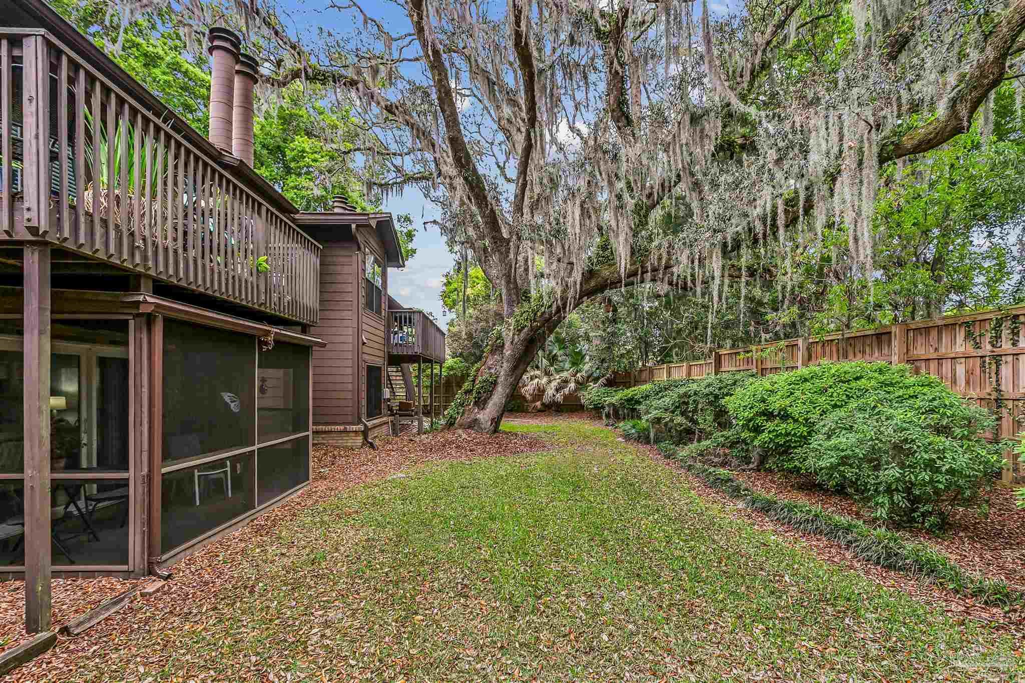 4831 East Olive Road, Unit 2D Pensacola, FL 32514 - Photo 29 of 29 a view of a house with a yard and pathway
