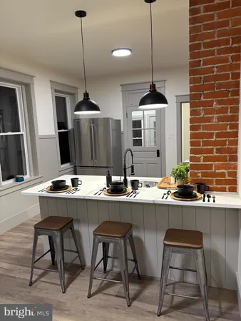a dining table with chairs and window