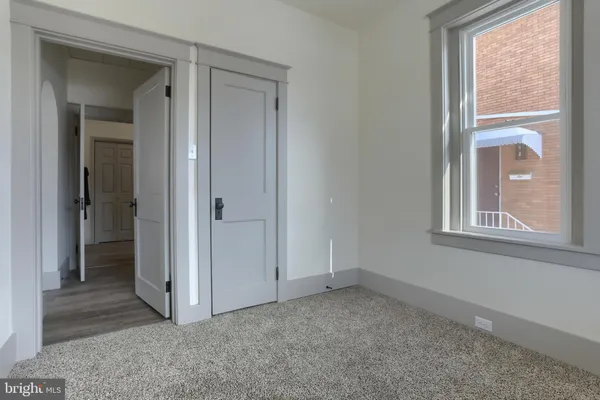 a bathroom with a sink toilet and a mirror