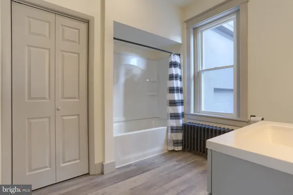 a view of an empty room with stairs and ventilation