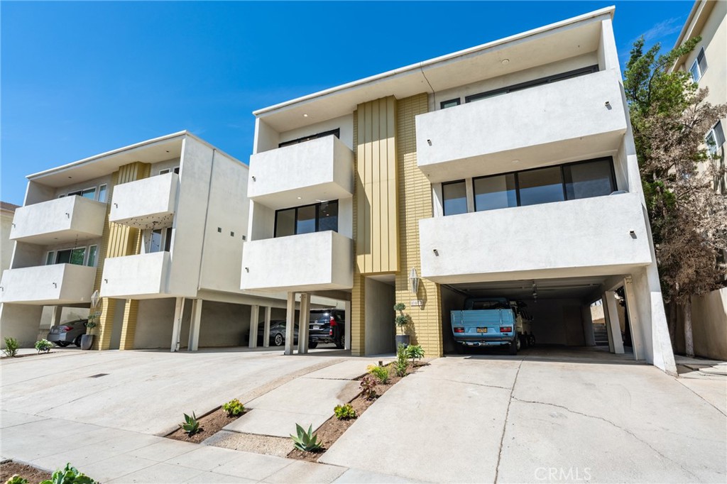 11919 Mayfield Avenue, Unit 2 Los Angeles, CA 90049 - Photo 19 of 75 a view of a building with car parked
