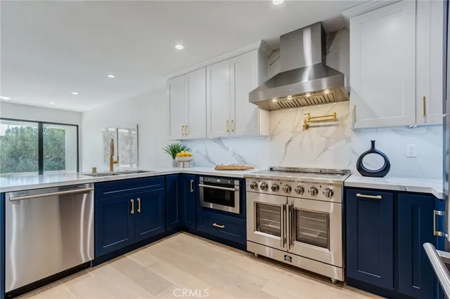 a kitchen with a stove and cabinets