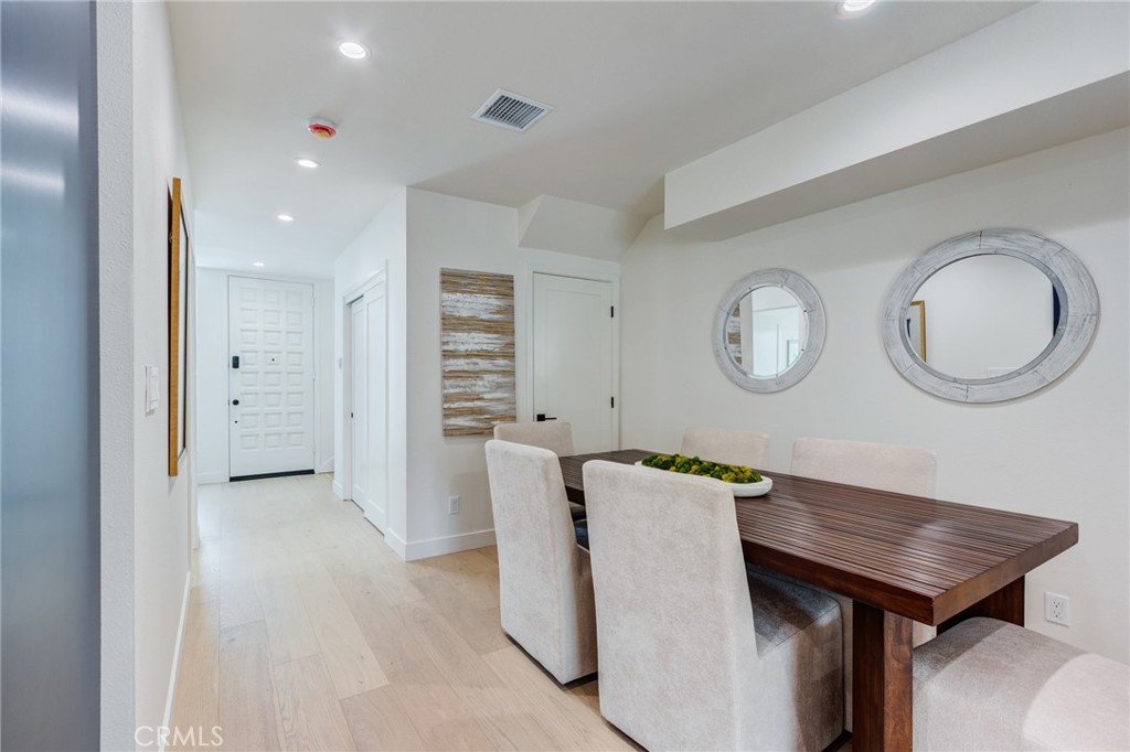 11919 Mayfield Avenue, Unit 2 Los Angeles, CA 90049 - Photo 23 of 75 a view of a room with furniture and a mirror