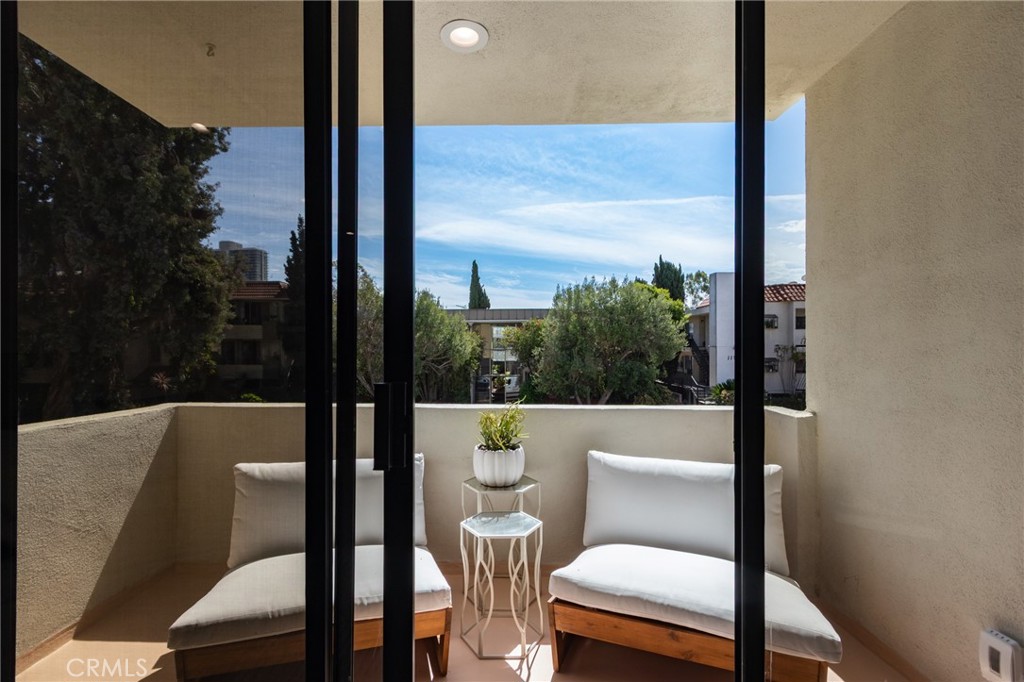 11919 Mayfield Avenue, Unit 2 Los Angeles, CA 90049 - Photo 27 of 75 a view of a balcony with chair