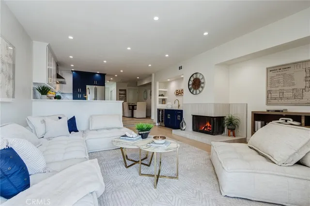 a view of a kitchen with a sink and a mirror