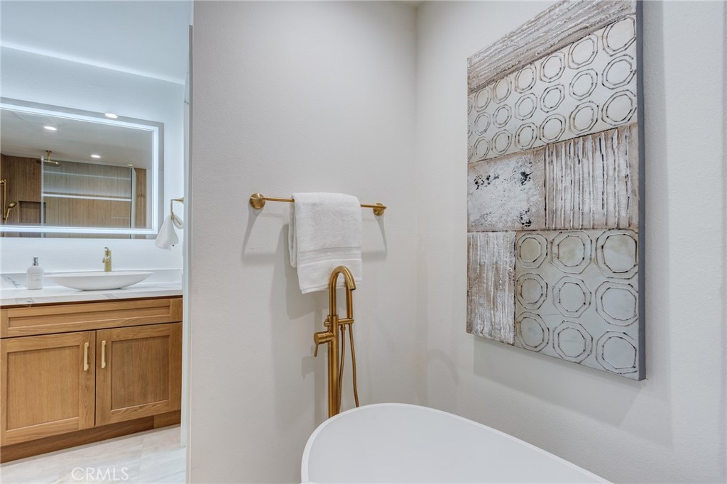 11919 Mayfield Avenue, Unit 2 Los Angeles, CA 90049 - Photo 45 of 75 a bathroom with a toilet sink and shower