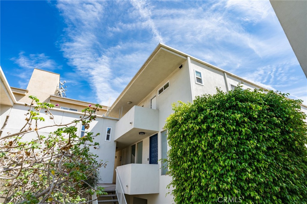 11919 Mayfield Avenue, Unit 2 Los Angeles, CA 90049 - Photo 59 of 75 a view of a house with a tree
