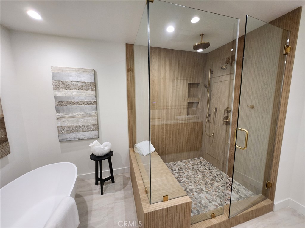 11919 Mayfield Avenue, Unit 2 Los Angeles, CA 90049 - Photo 9 of 75 a bathroom with a shower and a toilet