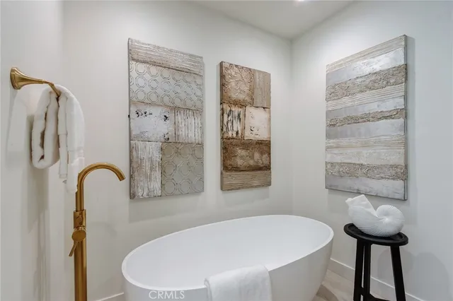 a view of a room with furniture and a mirror