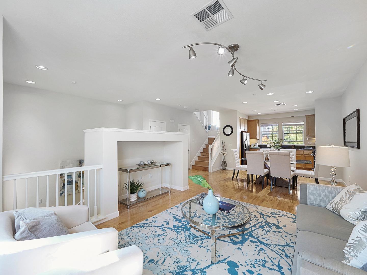 1144 Le Mans Terrace Sunnyvale, CA 94089 - Photo 11 of 29 a living room with furniture and a wooden floor