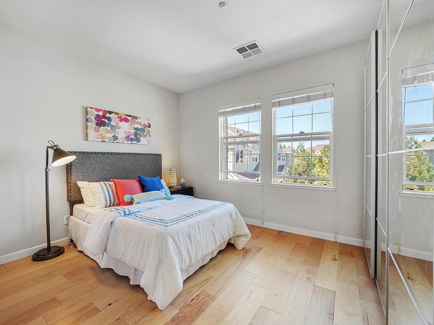 1144 Le Mans Terrace Sunnyvale, CA 94089 - Photo 13 of 29 a bedroom with a large bed and a window