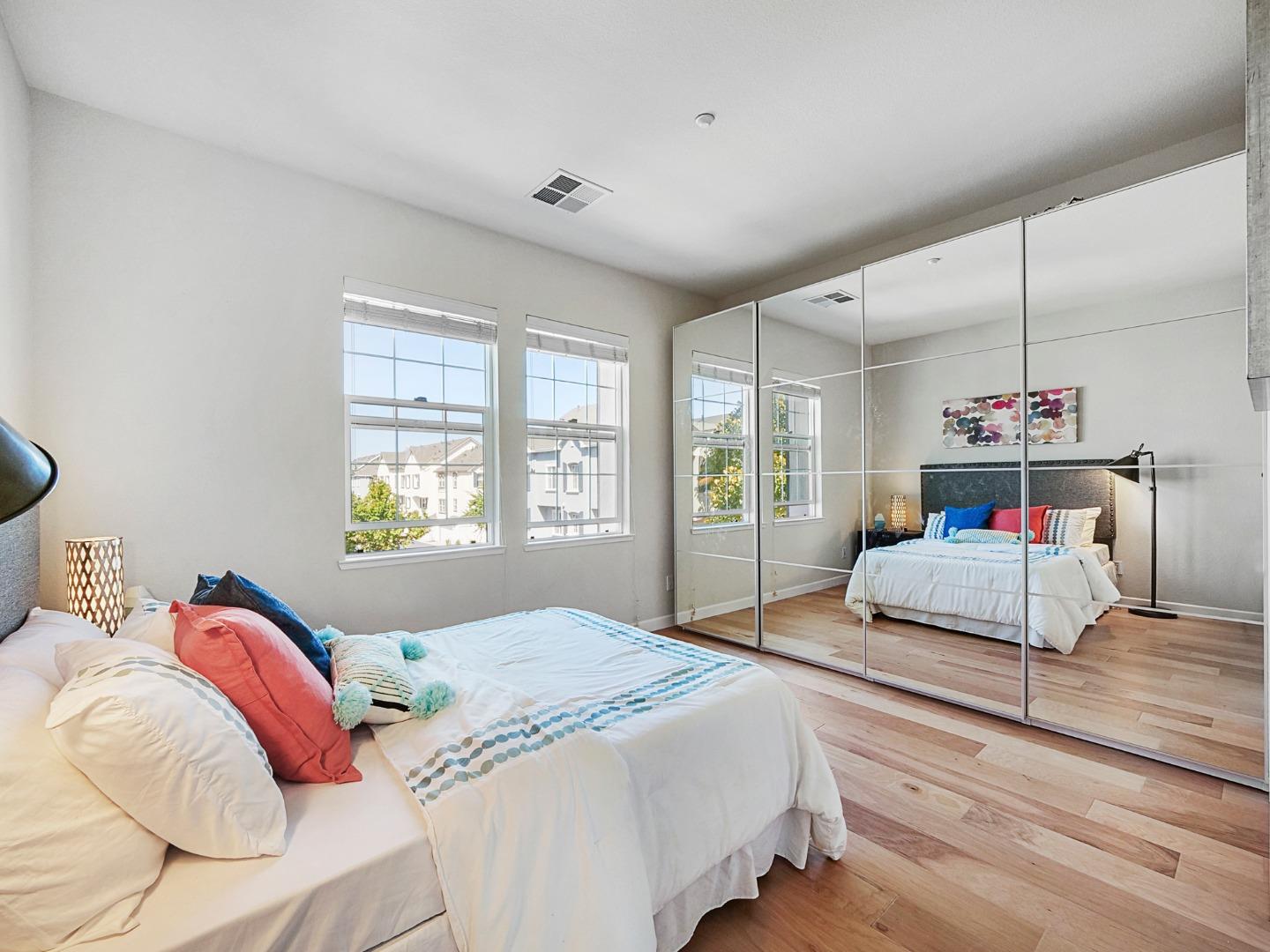 1144 Le Mans Terrace Sunnyvale, CA 94089 - Photo 14 of 29 a bedroom with a bed and window