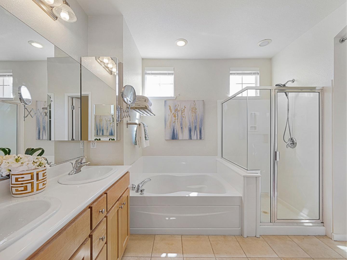 1144 Le Mans Terrace Sunnyvale, CA 94089 - Photo 20 of 29 a bathroom with a tub sink and mirror