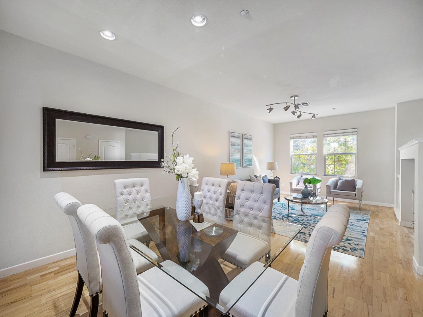 1144 Le Mans Terrace Sunnyvale, CA 94089 - Photo 8 of 29 a living room with furniture and a wooden floor