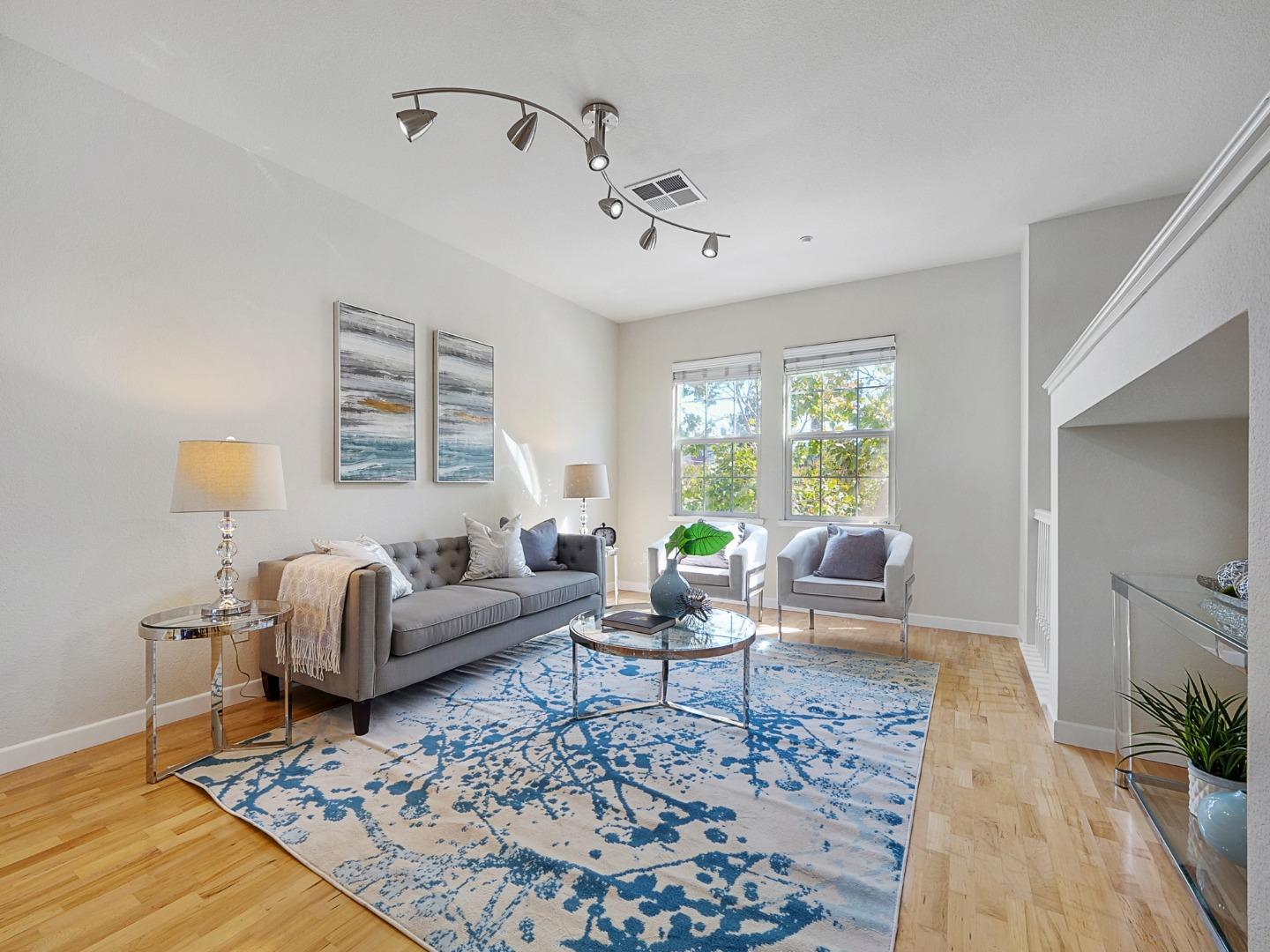 1144 Le Mans Terrace Sunnyvale, CA 94089 - Photo 9 of 29 a living room with furniture and wooden floor