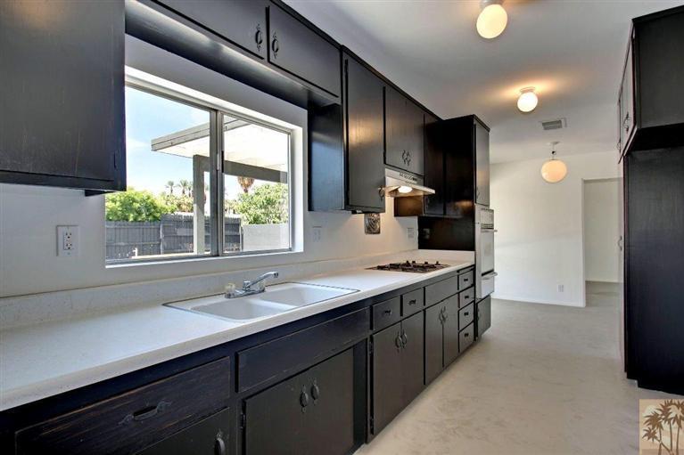 70080 Chappel Road Rancho Mirage, CA 92270 - Photo 12 of 24 a spacious bathroom with a double vanity sink and a large mirror