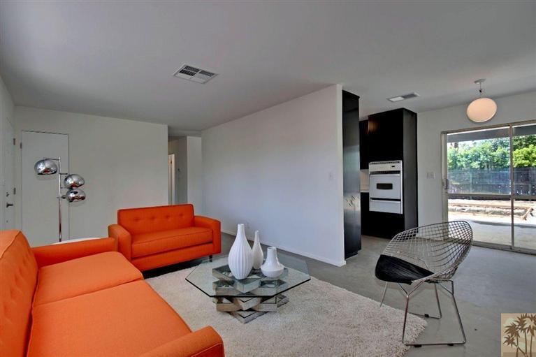 70080 Chappel Road Rancho Mirage, CA 92270 - Photo 8 of 24 a living room with furniture and a flat screen tv