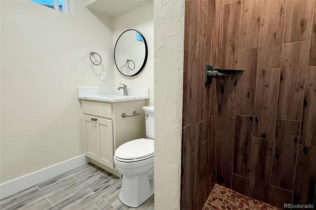 a bathroom with a toilet and a sink