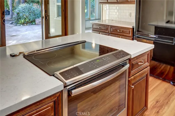 a view of a living room with a stove top oven