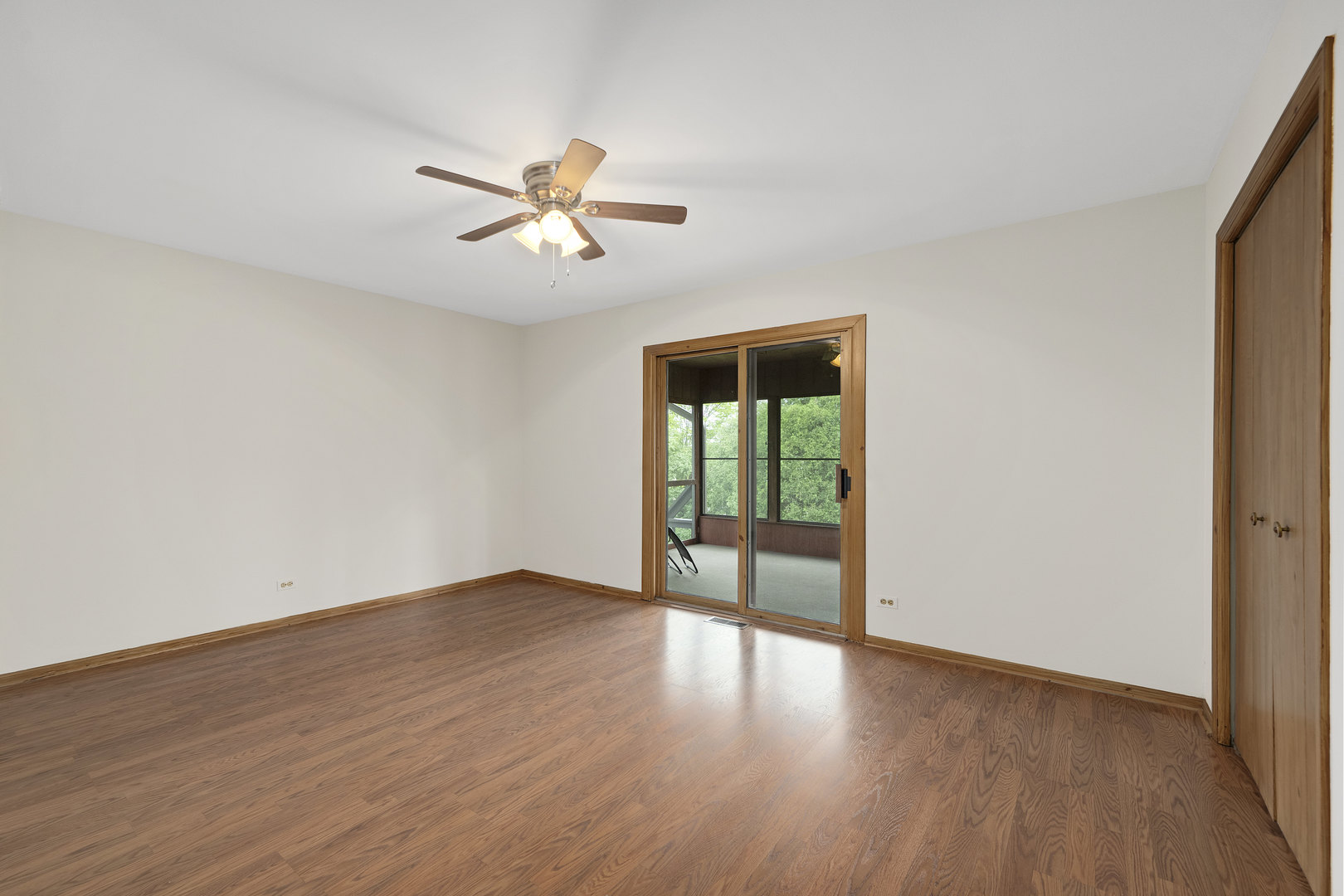 7019 Camden Road Downers Grove, IL 60516 - Photo 18 of 25 a view of empty room with wooden floor and fan