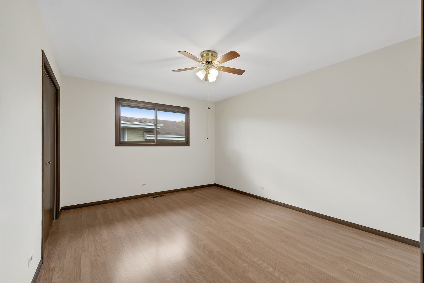 7019 Camden Road Downers Grove, IL 60516 - Photo 19 of 25 an empty room with a window and a fan