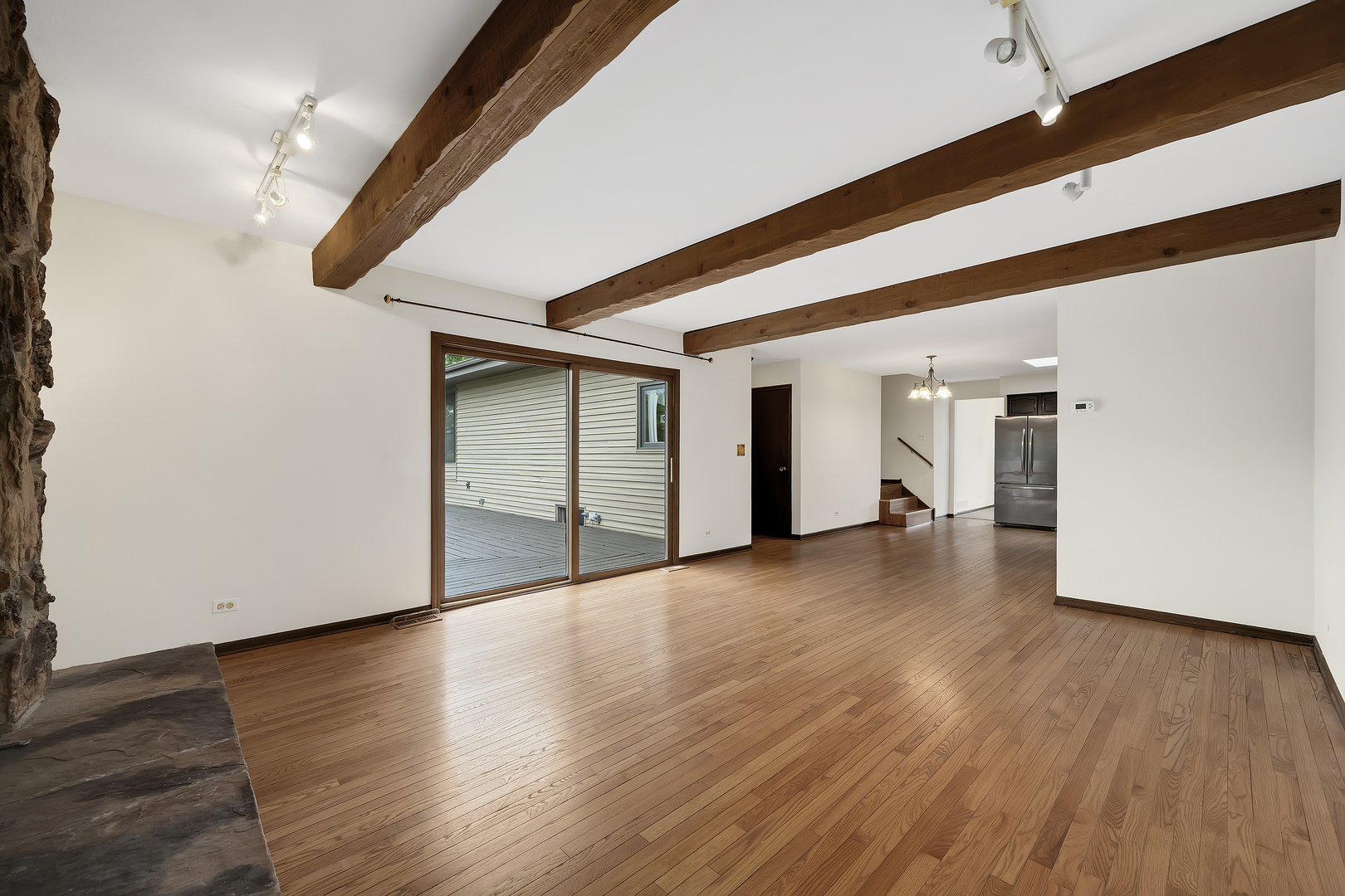 7019 Camden Road Downers Grove, IL 60516 - Photo 3 of 25 a view of an empty room with wooden floor