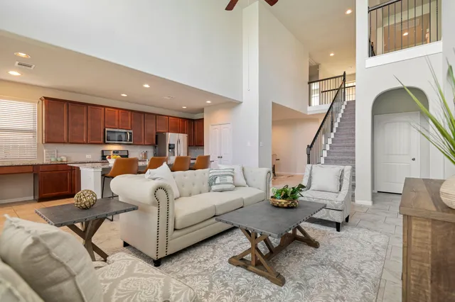 a living room with furniture and a fireplace