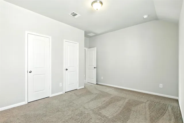 a view of a porch in front of a house with a yard