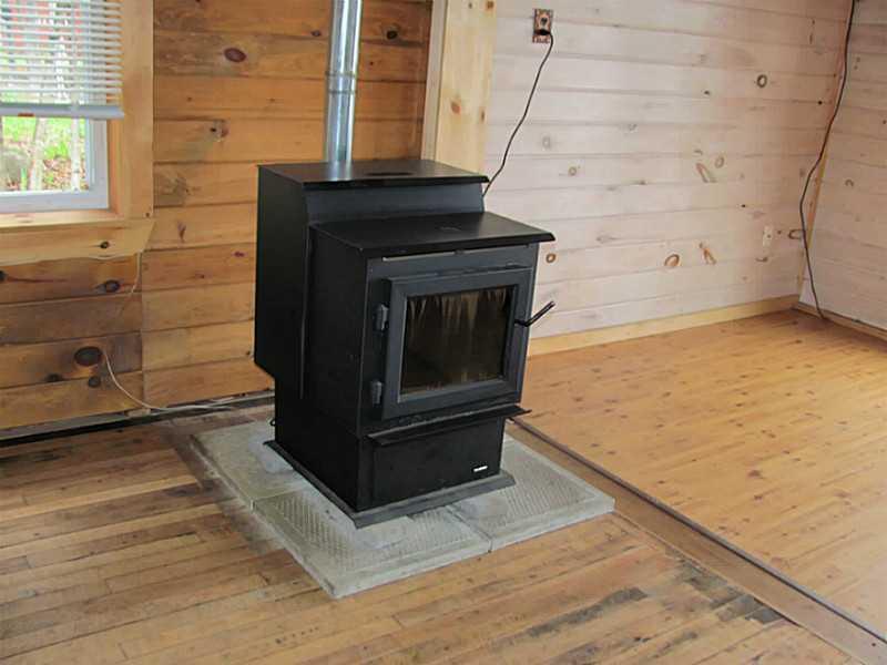 156 W Road Portage, ME 04768 - Photo 13 of 13 Exterior Front. Pellet Stove to keep...