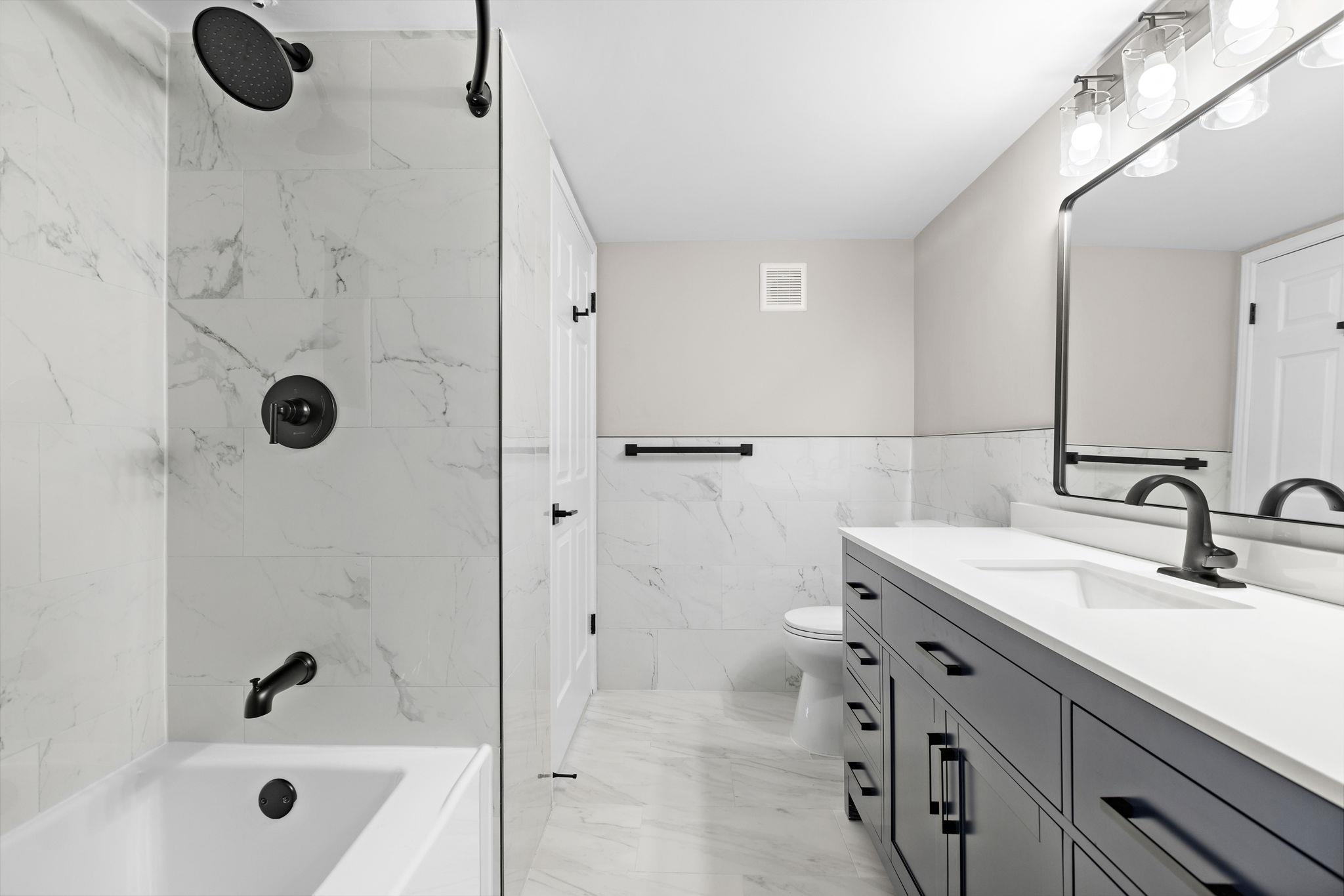 690 Route 23 Wayne Nj 07470, Unit R3 Wayne, NJ 07470 - Photo 11 of 13 a bathroom with a tub sink vanity and shower