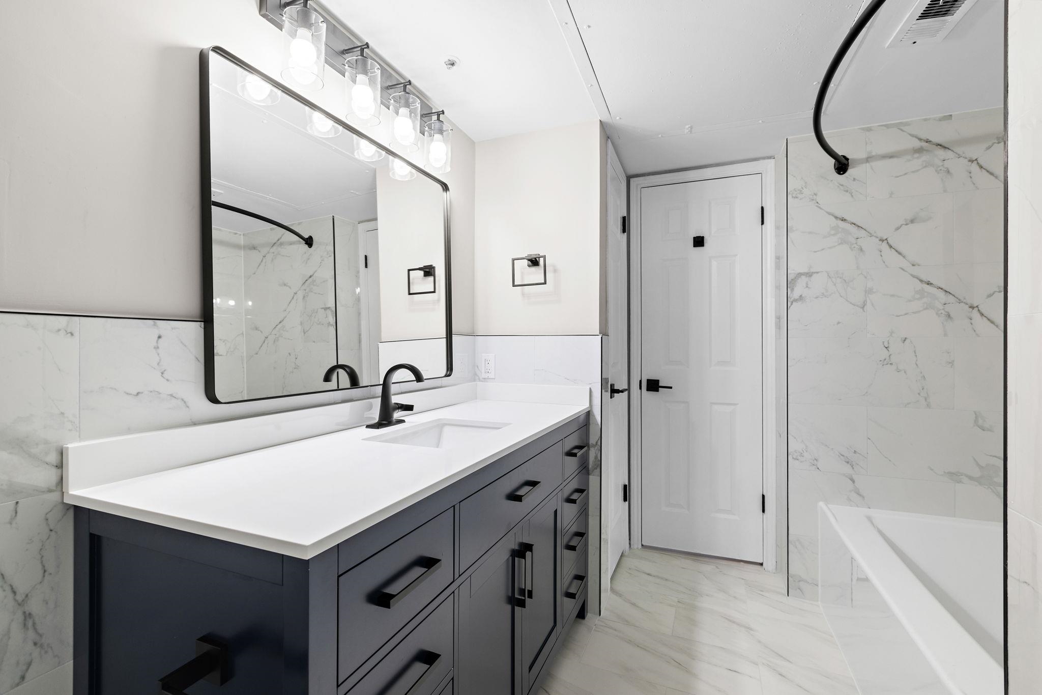 690 Route 23 Wayne Nj 07470, Unit R3 Wayne, NJ 07470 - Photo 10 of 13 a bathroom with a sink and a mirror