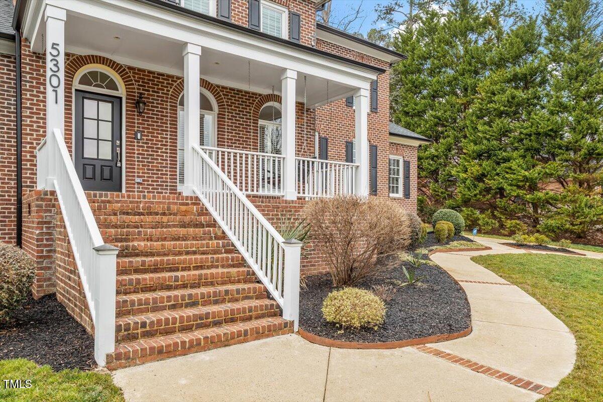 5301 Mandrake Court Raleigh, NC 27613 - Photo 54 of 65 a view of a house with backyard and trees