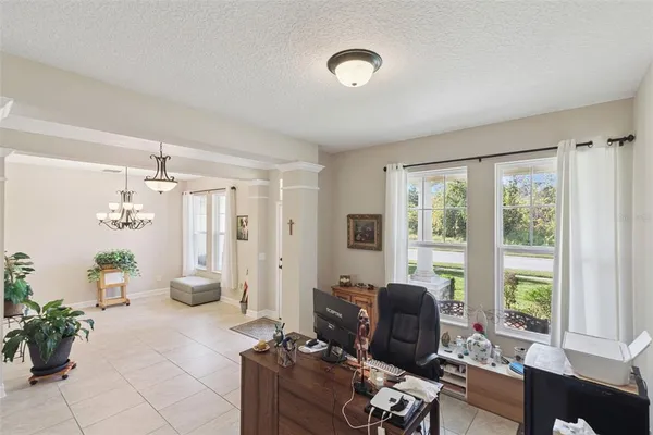 a kitchen with kitchen island a refrigerator a stove a counter space and wooden floor