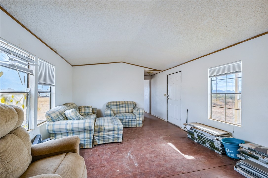 3598 Tonto Road Golden Valley, AZ 86413 - Photo 5 of 34 a living room with furniture and a window