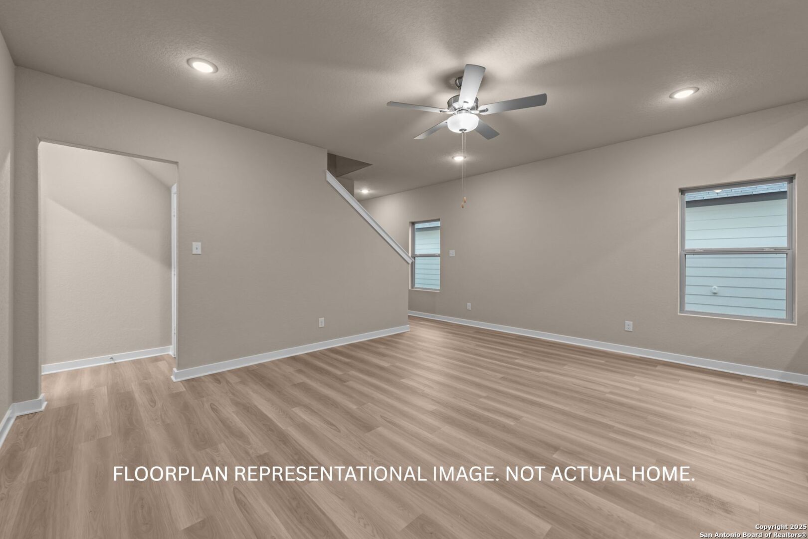 10403 Hotspur Road Converse, TX 78109 - Photo 16 of 28 an empty room with wooden floor closet and fan