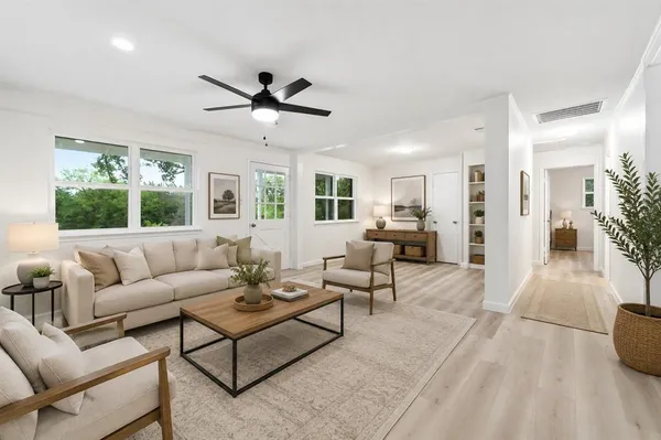 a living room with furniture and a large window