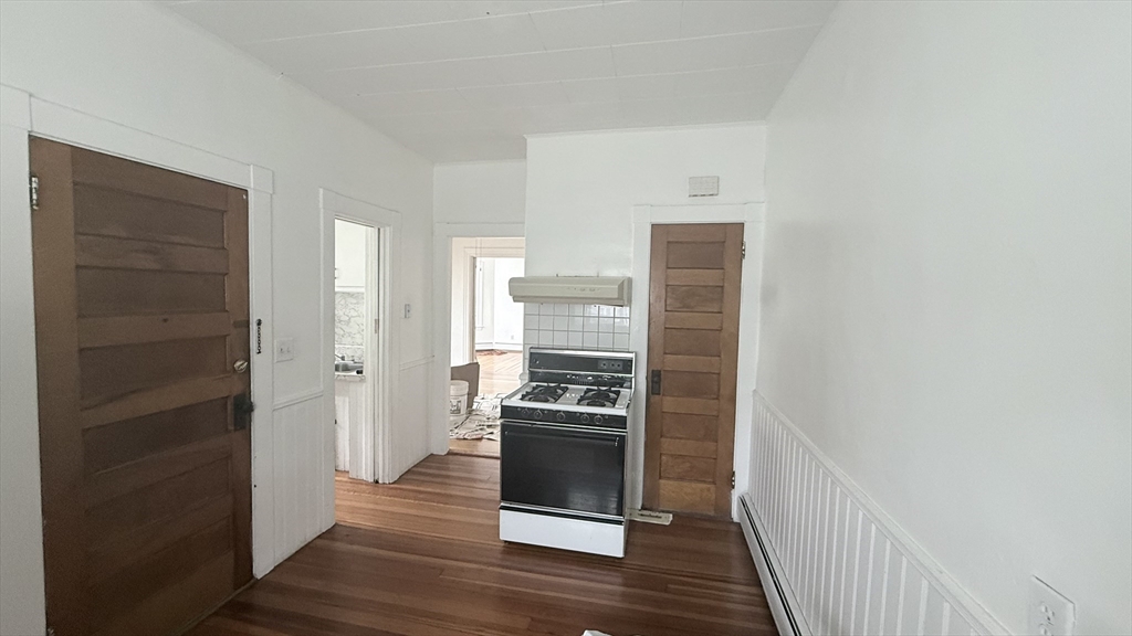 37 Berkley Street, Unit 2 Fall River, MA 02724 - Photo 11 of 11 a kitchen with a refrigerator and a stove top oven
