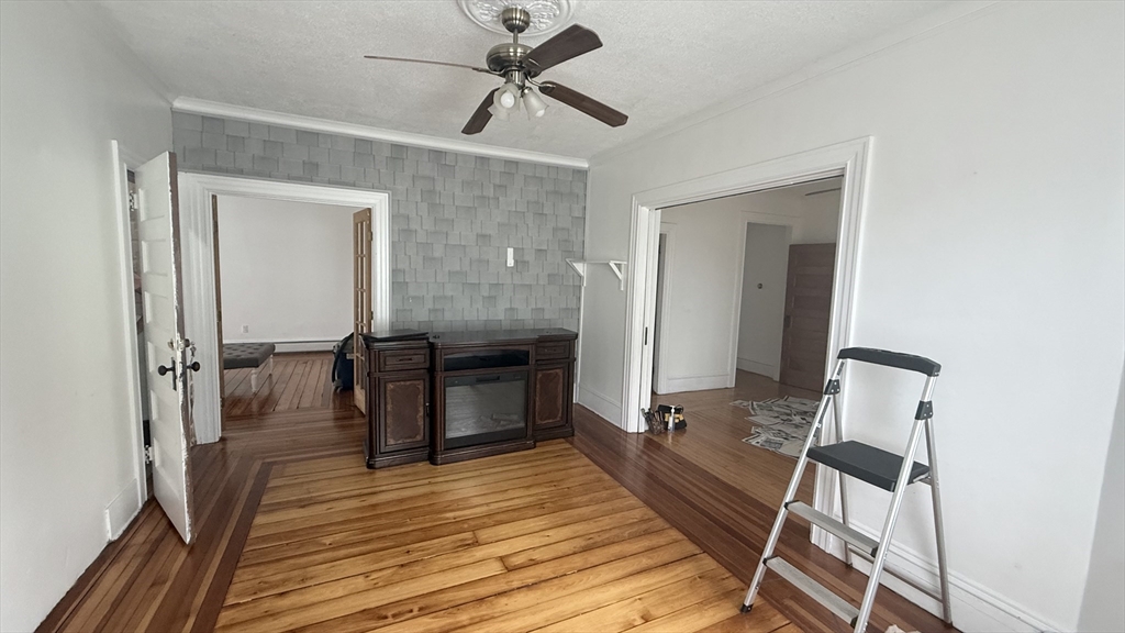37 Berkley Street, Unit 2 Fall River, MA 02724 - Photo 2 of 11 a view of a hallway with wooden floor and staircase