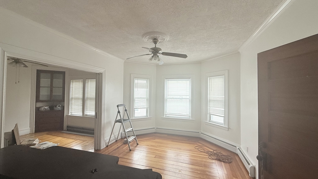37 Berkley Street, Unit 2 Fall River, MA 02724 - Photo 3 of 11 a view of livingroom with hardwood floor and a ceiling fan