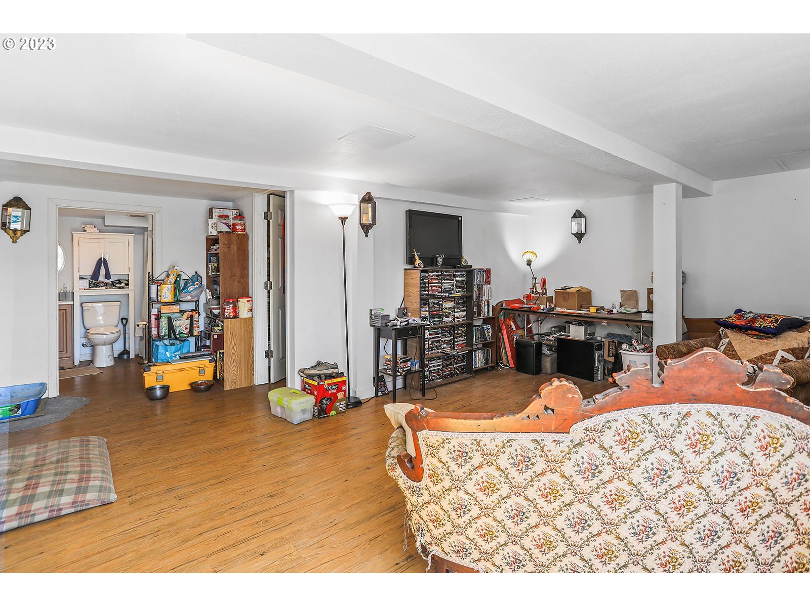 695 Main Street Dufur, OR 97021 - Photo 12 of 42 a living room with dining room and wooden floor