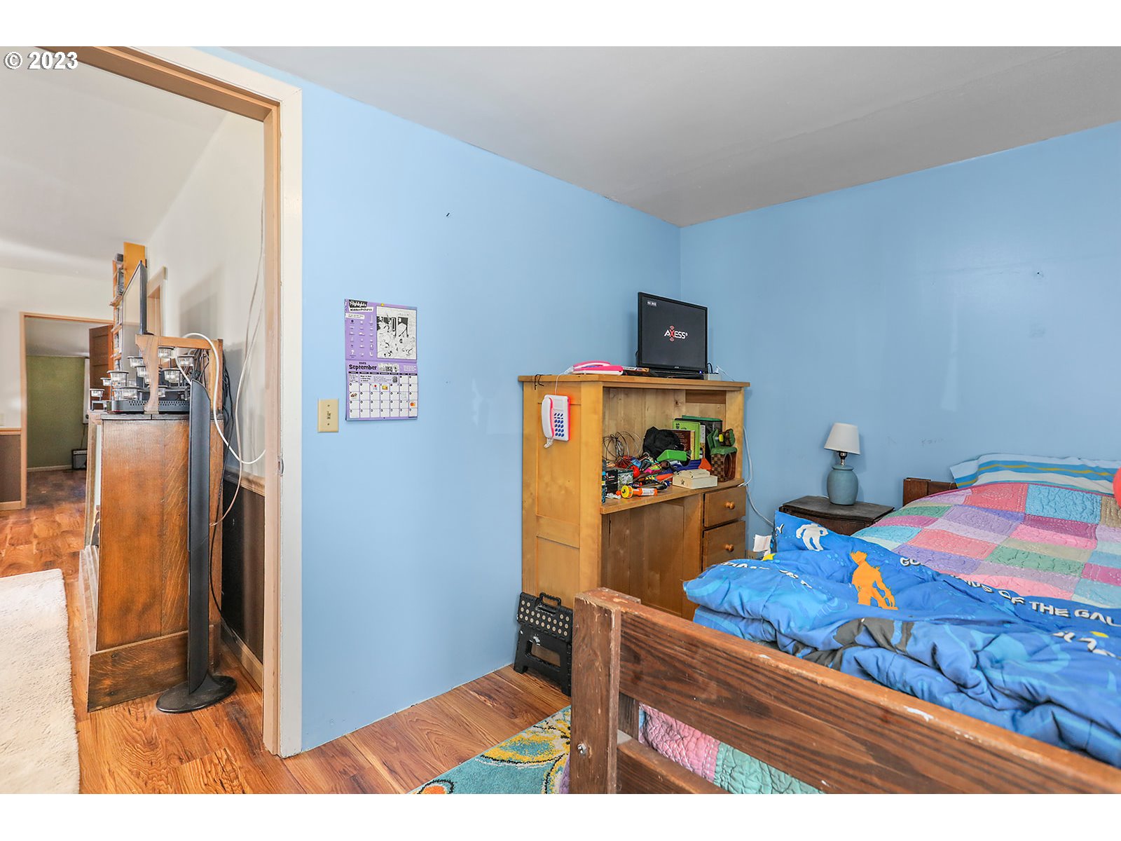 695 Main Street Dufur, OR 97021 - Photo 14 of 42 a bedroom with a bed and a dresser in it