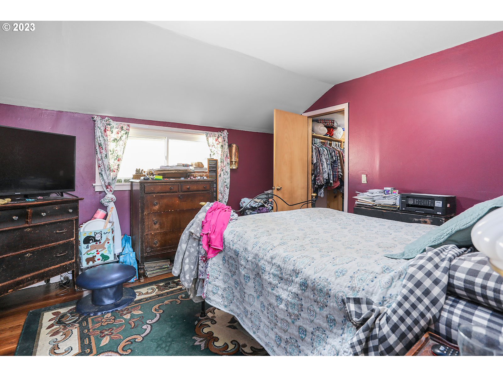 695 Main Street Dufur, OR 97021 - Photo 15 of 42 a bed room with a bed and a flat screen tv