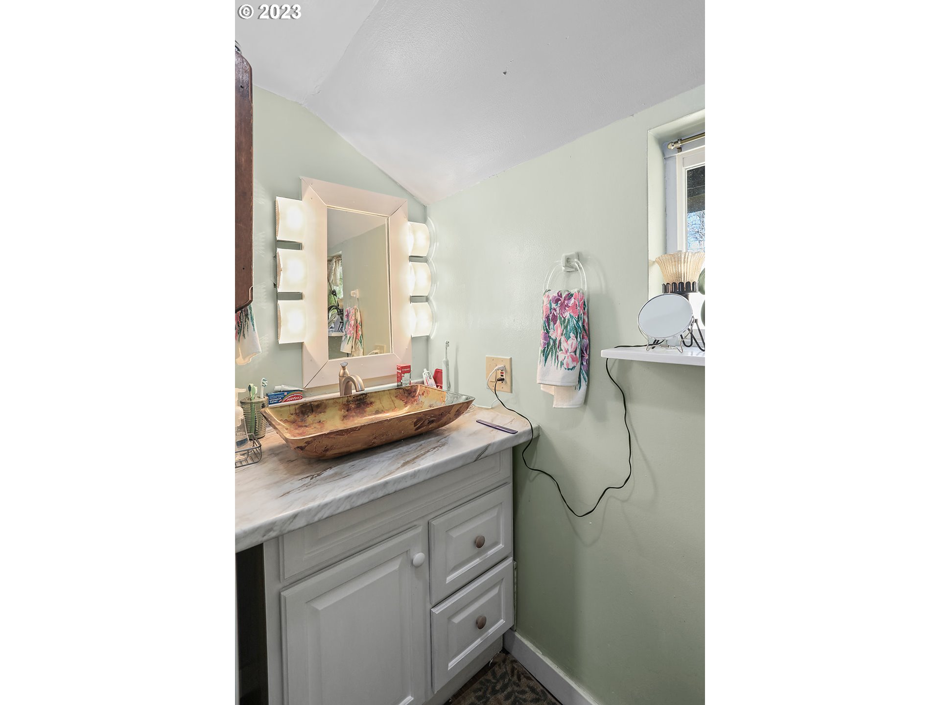 695 Main Street Dufur, OR 97021 - Photo 18 of 42 a en suite bathroom with a sink and a mirror