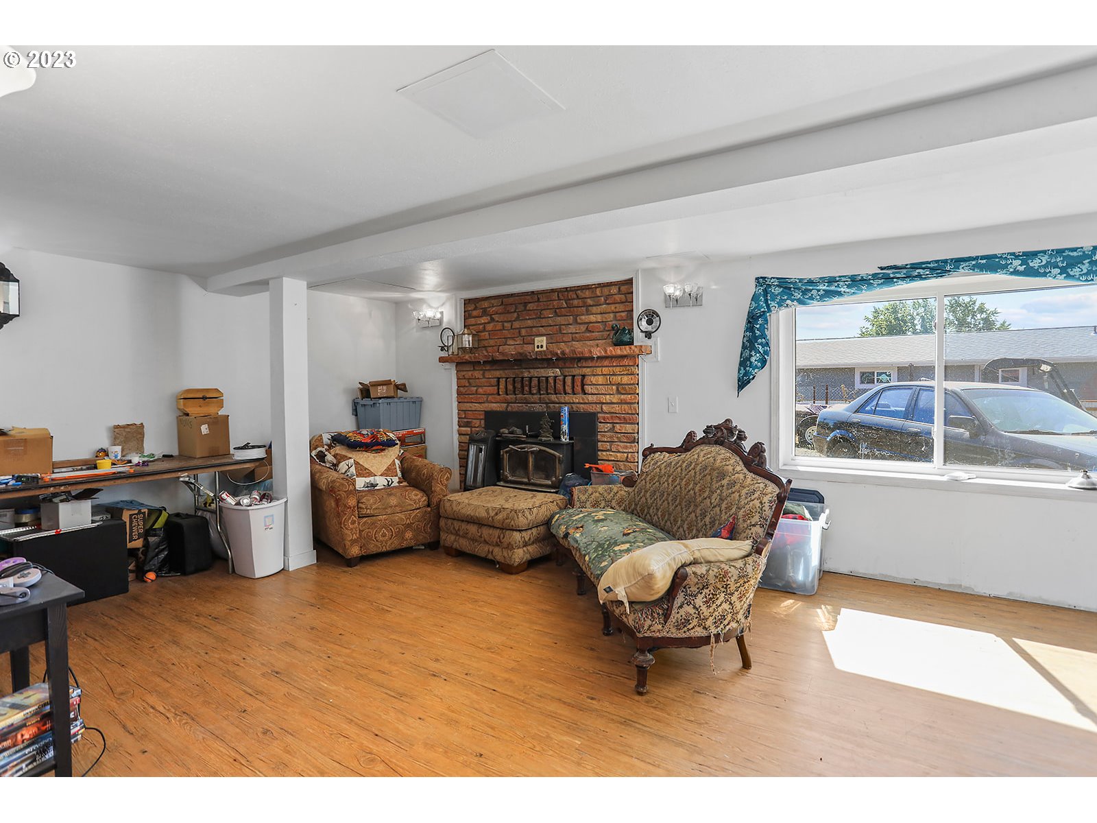 695 Main Street Dufur, OR 97021 - Photo 21 of 42 a living room with furniture and a fireplace